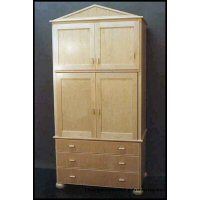 Hard white maple Armoire designed to hold clients a/v gear- central pocket doors, bun feet, and drawers sized to hold audio cassette, video cassette, and compact disks.   Pulls are a proprietary product -the doubled thumb-. 4/4 hard white maple lumber, 3/4 hard white maple veneer core plywood, concealed self-closing hinges. Finished with a clear acrylic resin lacquer.