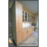 Hard white maple doors with 3/4 thick flat panels in frames. Stainless steel counters, ribbed glass doors, pantry pull out, low voltage halogen lighting