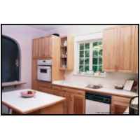 Natural maple raised panel kitchen. Uninstalled, refinished and reinstalled after an oak tree fell on the kitchen courtesy of hurricane Fran.