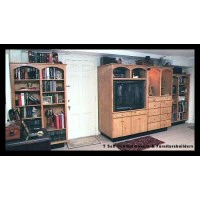 Knotty white pine bookcases and media center. The entire right section is on dual locking casters to facilitate a/v cabling and hookups.